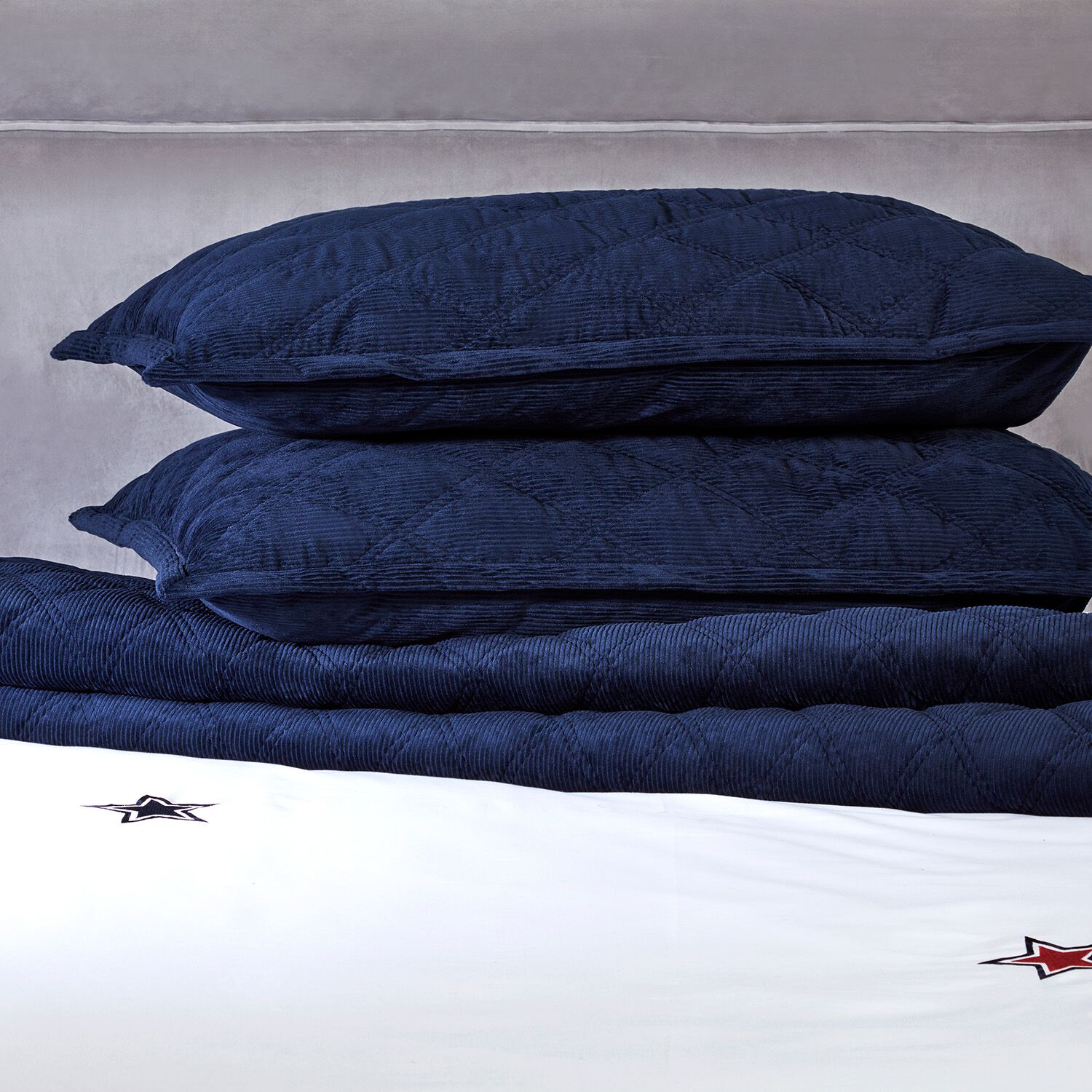 Navy quilted shop bedspread