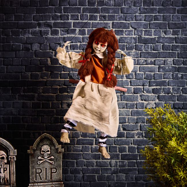 Doll On Swing Kicking Legs
