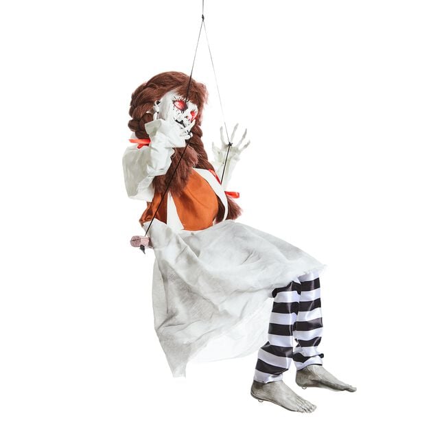Doll On Swing Kicking Legs