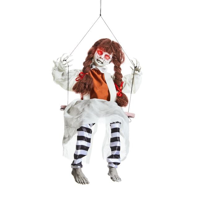 Doll On Swing Kicking Legs