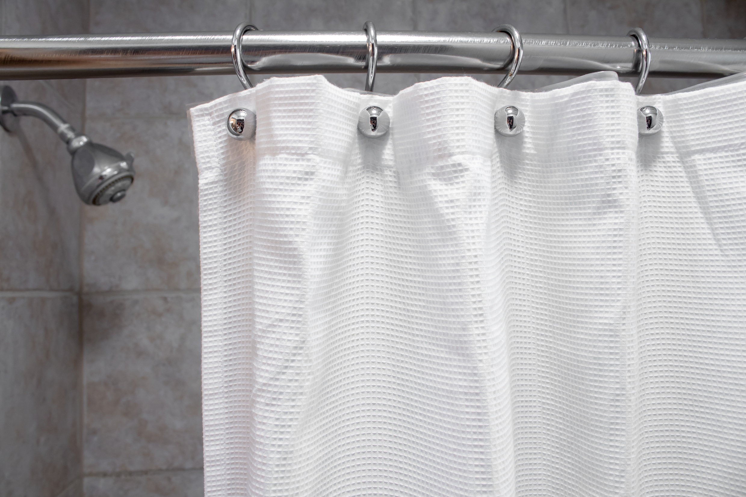 Use Extra Shower Curtain Rods to Increase Bathroom Storage & More